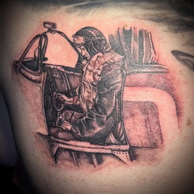 Commemorative illustrative tattoo of a vintage pilot in a cockpit